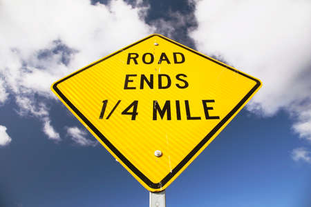 Sign stating Road Ends in 14 mileの写真素材