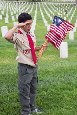 Boyscout salutes at one of 85, 000 US Flags at 2014 Memorial Day Event, Los Angeles National...