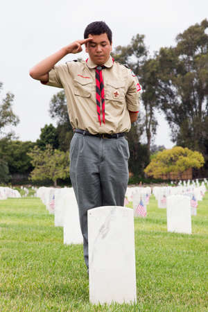 Boyscout saluting at one of 85, 000 US Flags at Annual Memorial Day Event, Los Angeles National Cemetery, California, USAのeditorial素材