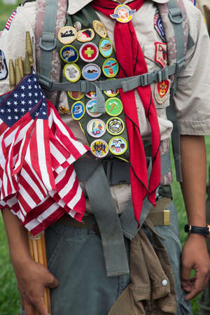 Boyscout merit bades and US Flags at 2014 Memorial Day Event, Los Angeles National Cemetery, California, USAのeditorial素材