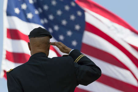 Ret. Milton S. Herring saluting U.S. flag, Los Angeles National Cemetery Annual Memorial Event, May 26, 2014, California, USAのeditorial素材