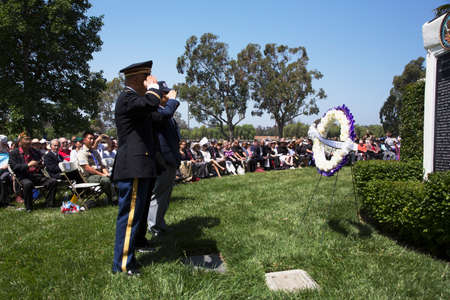 Unification Advisory Council saluting during Los Angeles National Cemetery Annual Memorial Event, May 26, 2014, California, USAのeditorial素材