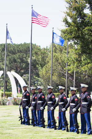 US Marines stand at attention at Memorial Service for fallen US Soldier