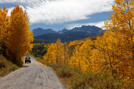 Jeep drives down backroad in San Juan Mountains In Autumn Colorado, near Telluride, Ouray and Ridgway in San Miguel Countyのeditorial素材