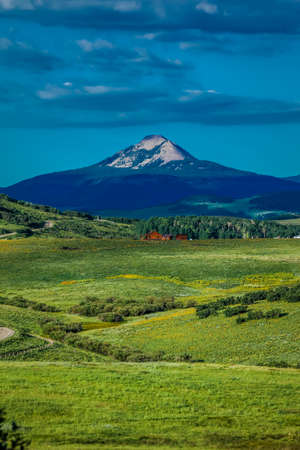 July 14, 2016 - Log Cabin with Mountains and green trees - San Juan Mountains, Colorado, USAのeditorial素材
