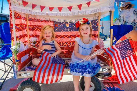 JULY 4, 2016 - Citizens of Ojai California celebrate Independence Day - little girls hold US Flagsのeditorial素材