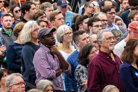 Keene, New Hampshire - OCTOBER 17, 2016: Crowd watches former U.S. President Bill Clinton speaks on behalf of his wife Democratic presidential nominee Hillary Clinton during a campaign event at Keene College.のeditorial素材