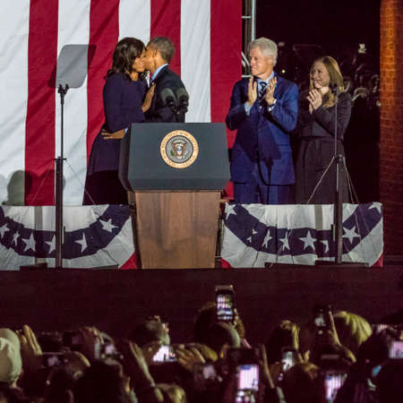 NOVEMBER 7, 2016, INDEPENDENCE HALL, PHIL., PA - President and Michelle Obama hug at podium at election eve get out the Vote Rally Independence Hall, Phil. PA.のeditorial素材