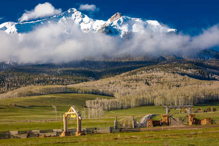 APRIL 27, 2017 - HASTINGS MESA near RIDGWAY AND TELLURIDE COLORADO - Ranch Gate for historic Last Dollar Ranch and Aspen View Ranch, owned by photographer Joseph Sohm, we see ail Fence and San Juan Mountainsのeditorial素材