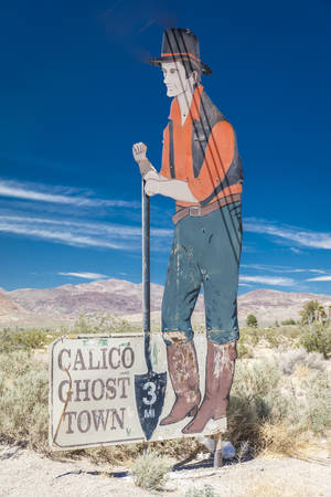 APRIL 27, 2017 - Sign and image of old miner on road to Calico Ghost Town, Southern California in the Mojave Desertのeditorial素材