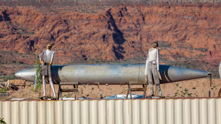 April 27, 2017 Roadside attraction of Bomb, dummy's and redrock mountains, just outside of Moab Utahの写真素材