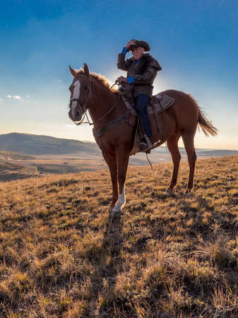 OCT 4, 2017, RIDGWAY COLORADO - Older Cowboy, Howard Linscott looks out over historic Last Dollar Ranch on Hastings Mesa, SW Colorado, San Juan Mountainsのeditorial素材