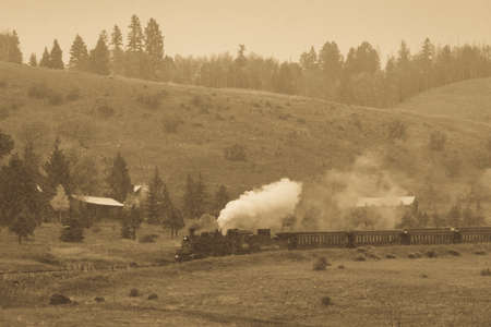 OCTOBER 9, 2018 - New Mexico, USA - Cumbres & Toltec Scenic Steam Train, from Chama, New Mexico to Antonito, Colorado over Cumbress Pass 10,015 Elevation - in Autumn and fresh snow - along Highway 17のeditorial素材