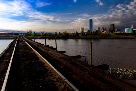 OCTOBER 11, 2018 - Oklahoma City, USA - we see railroad tracks reflection and Oklahoma City Skyline, Oklahoma City, Oklahomaのeditorial素材