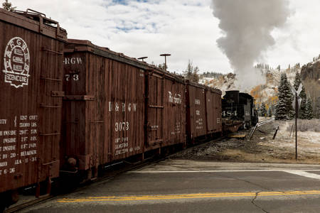 OCTOBER 9, 2018 - New Mexico, USA - Cumbres & Toltec Scenic Steam Train, from Chama, New Mexico to Antonito, Colorado over Cumbress Pass 10,015 Elevation - in Autumn and fresh snow - along Highway 17のeditorial素材