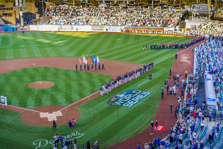 OCTOBER 26, 2018 - DODGER STADIUM, LOS ANGELES, CALIFORNIA, USA - giant US Flag is unfurled for...