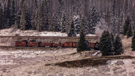 OCTOBER 9, 2018 - New Mexico, USA - Cumbres & Toltec Scenic Steam Train, from Chama, New Mexico to Antonito, Colorado over Cumbress Pass 10,015 Elevation - in Autumn and fresh snow - along Highway 17のeditorial素材