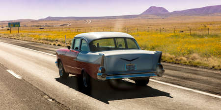 SEPT 13, 2018 - Texas, USA - Vintage 1957 historic Chevrolet drives through remote Texas Landscapeのeditorial素材