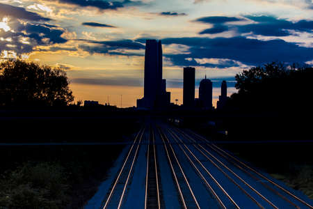 OCTOBER 11, 2018 - Oklahoma City, USA - we see railroad tracks reflection and Oklahoma City Skyline, Oklahoma City, Oklahomaのeditorial素材