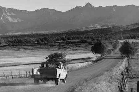 September 28,, 2018, USA - Pickup truck drives County Road 24 near Ridgway Colorado looking towards San Juan Mountainsのeditorial素材