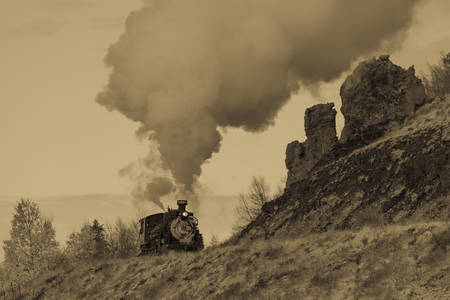 OCTOBER 9, 2018 - New Mexico, USA - Cumbres & Toltec Scenic Steam Train, from Chama, New Mexico to Antonito, Colorado over Cumbress Pass 10,015 Elevation - in Autumn and fresh snow - along Highway 17のeditorial素材