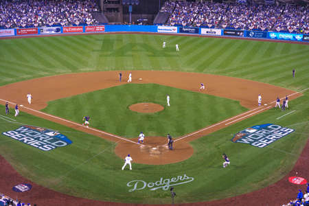 OCTOBER 26, 2018 - LOS ANGELES, CALIFORNIA, USA - DODGER STADIUM: Outfielder Cory Bellinger throws out Boston's Ian Kinsler as Austin Barnes tags him out - LA Dodgers defeat Boston Red Sox 3-2 in game 3 the longest game in World Series History - 18 inningのeditorial素材