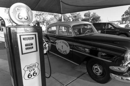 Kingman, Arizona, USA, July 2, 2018 - old Route 66, shows vintage Police Car and Gas Pump in black and whiteのeditorial素材