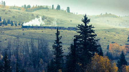 OCTOBER 9, 2018 - New Mexico, USA - Cumbres & Toltec Scenic Steam Train, from Chama, New Mexico to Antonito, Colorado over Cumbress Pass 10,015 Elevation - in Autumn and fresh snow - along Highway 17のeditorial素材