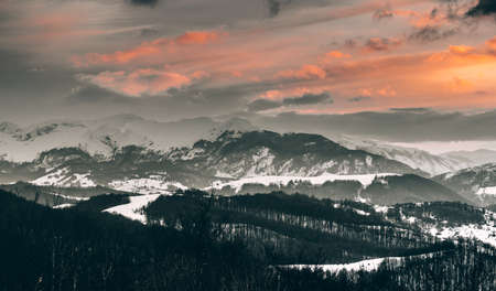 Mountains at sunset in winterの写真素材