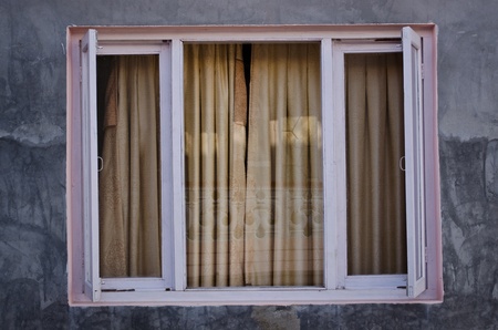 a pink window on cement wallのeditorial素材