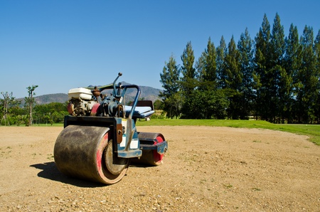 mini Steamroller parking on sand use in golf-courseの写真素材