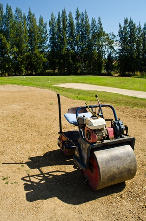 mini Steamroller parking on sand use in golf-courseの写真素材