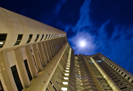 worm's eye view of a condo in the middle of the nightの写真素材