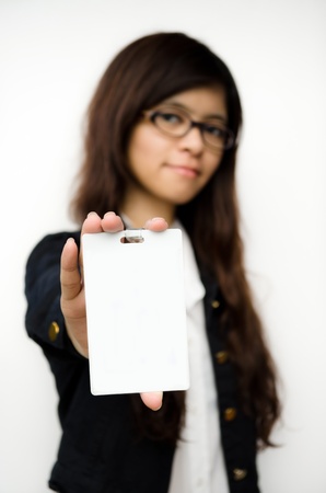 business woman showing blank id cardの写真素材