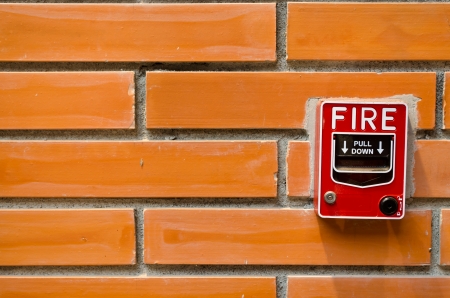 fire alarm on brick wallの写真素材