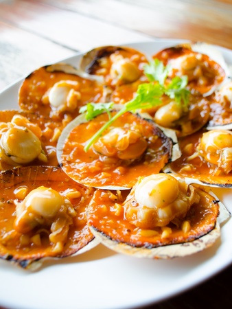 shell with spicy sauce  serve in thai restaurantの写真素材