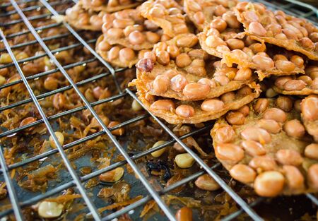 close up of hot fried peanut on colanderの写真素材