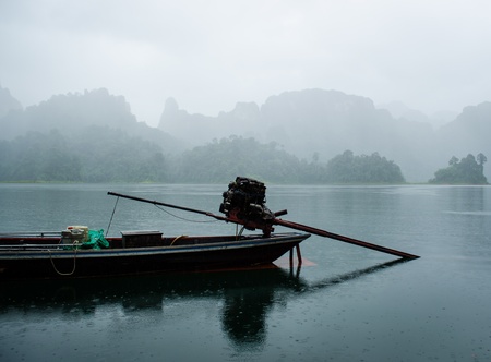 lake view with mountian in the fog during rainy in thailandの写真素材