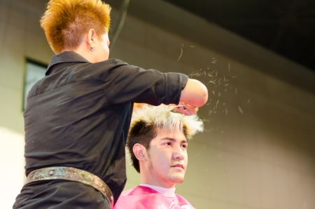 BANGKOK THAILAND -DEC hairdresser and  hair model during competition in thailand open hair championship, december 19, 2012のeditorial素材
