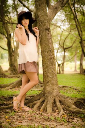 portrait of a happy asian girl in the gardenの写真素材