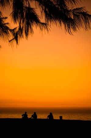 silhouette of a happy family on the beachの写真素材