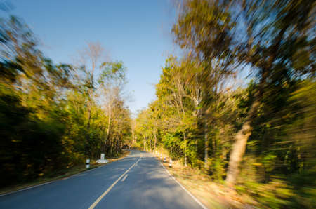 road in countryside with motion blur effectの写真素材