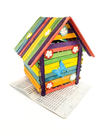 colorful toy house and bank account book isolatd on white backgroundの写真素材