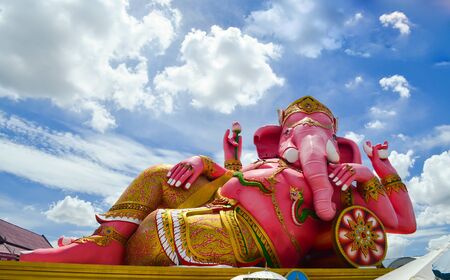 giant pink ganesha against blue skyの写真素材