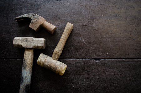 set of hammer on wood backgroundの写真素材