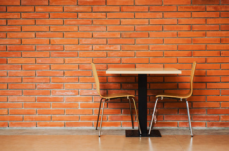 table set against brickwallの写真素材