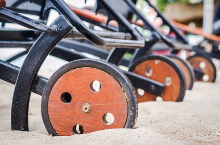 close up of wood wheel on the beachの写真素材