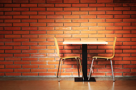 table set against brickwallの写真素材