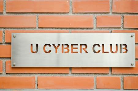 iron sign on brick wallの写真素材