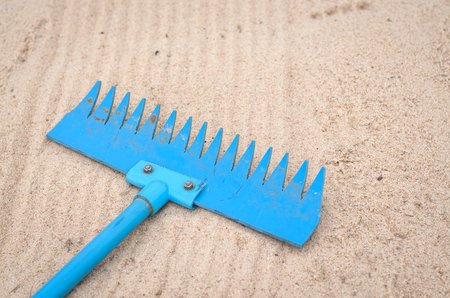 blue sand sweeper made from pipeの写真素材